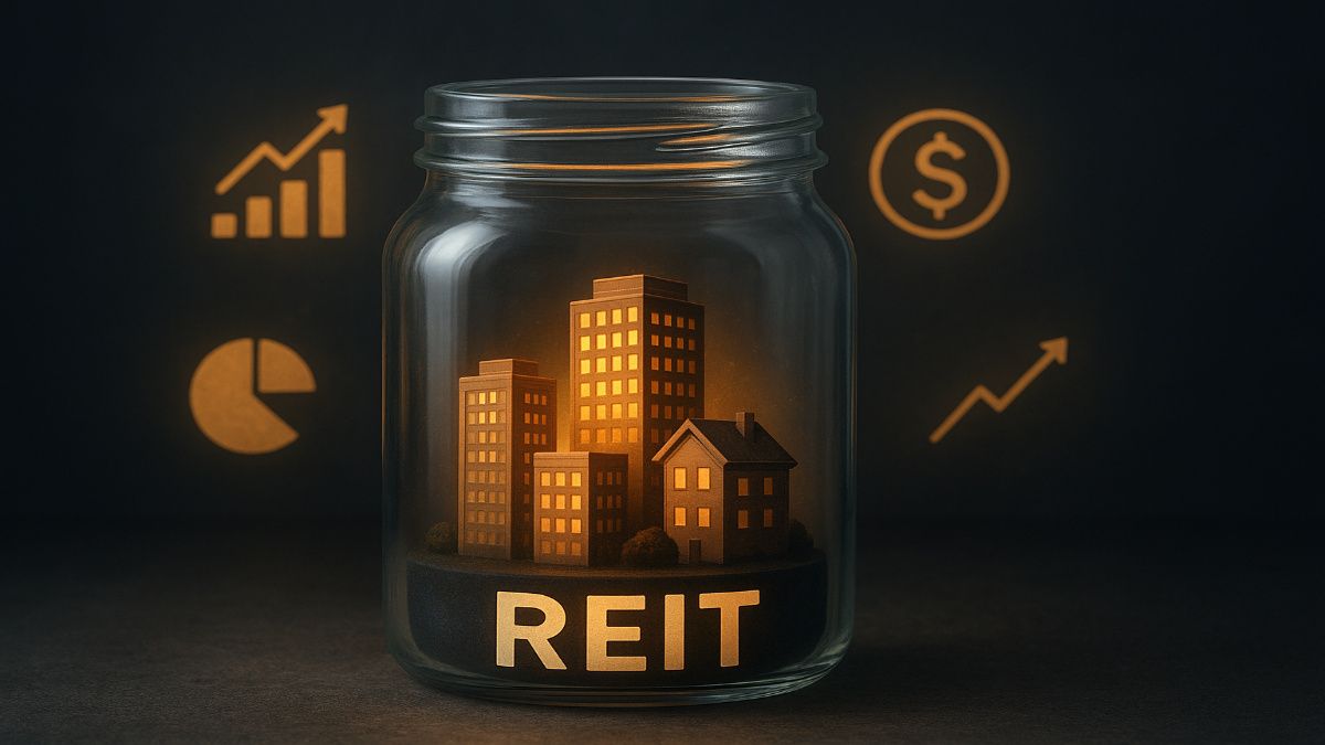 Real estate buildings inside a glass jar labeled “REIT”